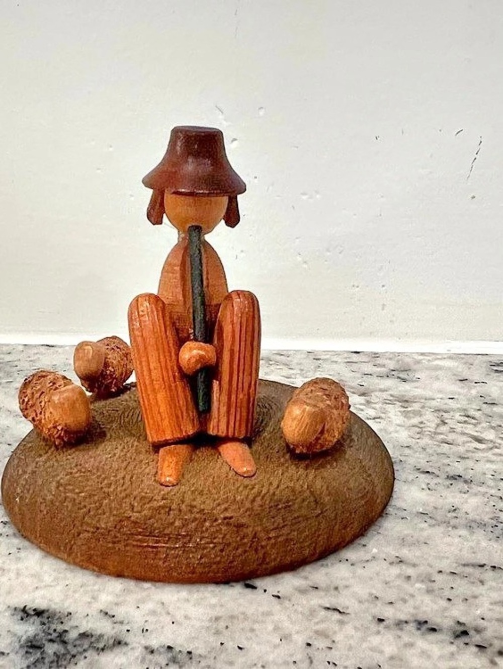 vintage hand-carved wooden figurine of a shepherd playing a flute Poland